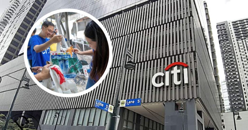 A group of Citi Philippines volunteers painting and engaging in community service activities in front of the Citi building.