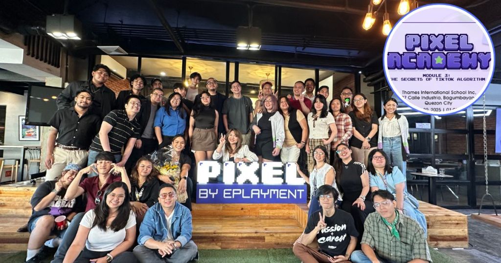 Group photo of participants and mentors at PIXEL Academy's final session, featuring a banner with the program name.