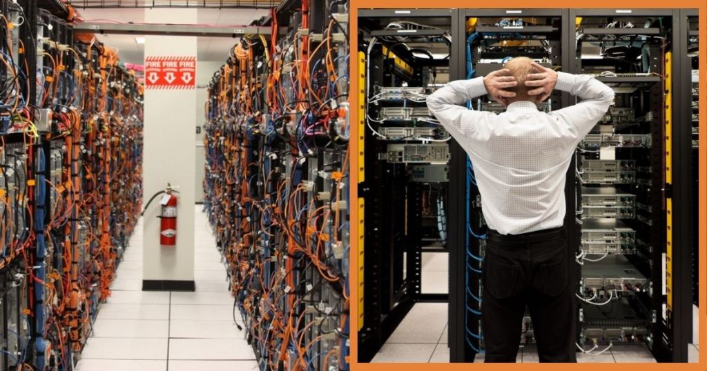A data center aisle filled with server racks and tangled cables, with a fire extinguisher visible on the side.