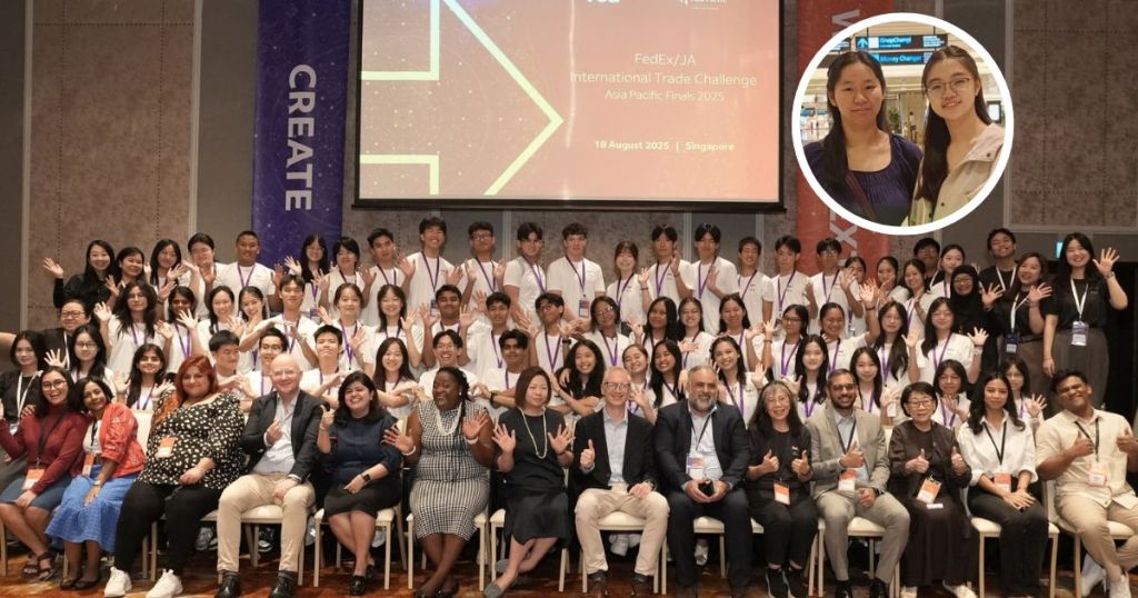 Group photo of participants and judges at the 2025 FedEx/JA International Trade Challenge in Singapore, showcasing diverse students and mentors, with a banner in the background highlighting the event.