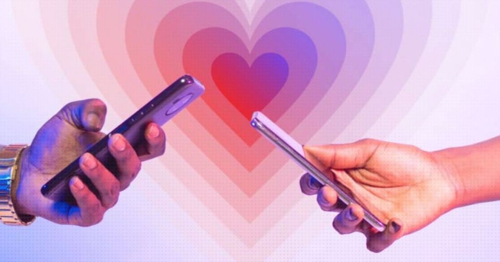 Two hands holding smartphones, reaching towards each other, with a colorful heart design in the background.