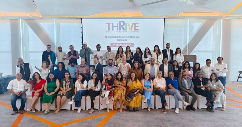 Group photo of participants at the THRIVE event, held at Cinnamon Life, City of Dreams, Colombo from 12-14 March 2023. The attendees are arranged in multiple rows, smiling and posing for the camera in a modern venue.