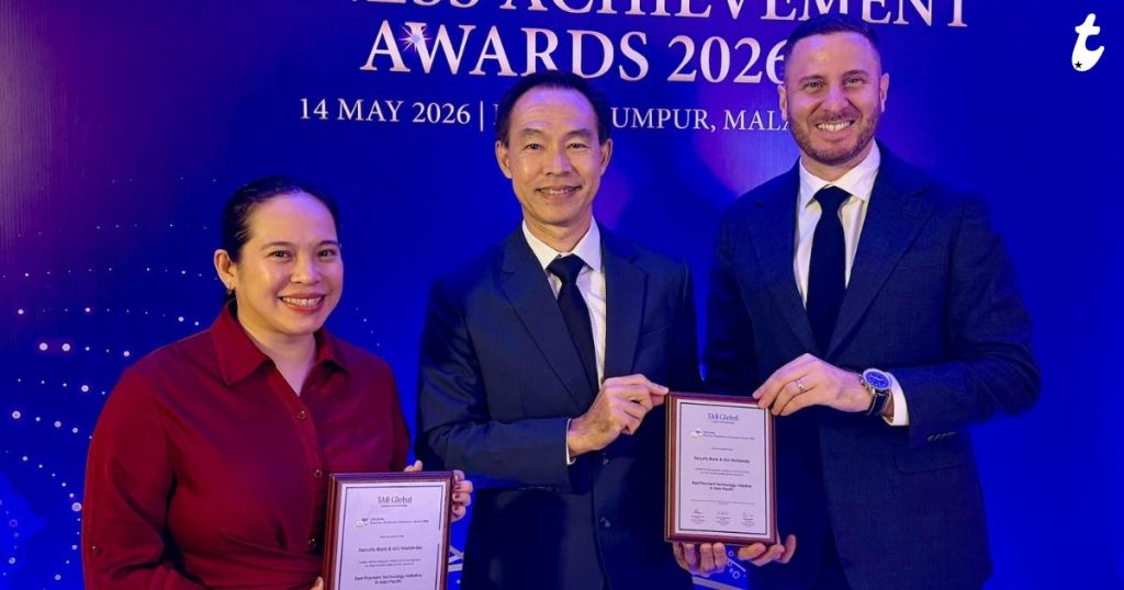 Three individuals posing with awards at the Achievement Awards 2026 event in Kuala Lumpur, Malaysia.