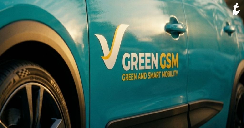 Close-up of a teal car featuring the logo 'GREEN GSM' and the tagline 'GREEN AND SMART MOBILITY' on its side.